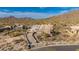 Aerial view of home construction site in the desert with mountain backdrop at 7646 E Hidden Canyon St, Mesa, AZ 85207