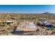 Aerial view of a home under construction in a developed neighborhood, showcasing the framing progress at 7646 E Hidden Canyon St, Mesa, AZ 85207