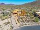 Framing stage of a luxury desert home showing the foundation and structure with desert landscape at 7646 E Hidden Canyon St, Mesa, AZ 85207