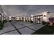 A modern home boasting a large courtyard, complemented by neat landscaping and an inviting pool at 7646 E Hidden Canyon St, Mesa, AZ 85207