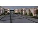 A modern home showcasing a courtyard with elegant landscaping and large windows at 7646 E Hidden Canyon St, Mesa, AZ 85207