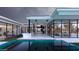 Elegant outdoor space with a modern pool, open layout, and stylish outdoor kitchen at 7646 E Hidden Canyon St, Mesa, AZ 85207