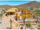 New home being built in the desert with wood framing and cacti landscape at 7646 E Hidden Canyon St, Mesa, AZ 85207