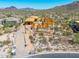 Exterior elevation of desert home under construction showcasing wood framing and mountain views at 7646 E Hidden Canyon St, Mesa, AZ 85207