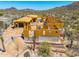 Exterior view of a new home showcasing wood framing and desert landscape under construction at 7646 E Hidden Canyon St, Mesa, AZ 85207