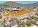 View of a new construction, desert home showcasing its wood framing and concrete foundation at 7646 E Hidden Canyon St, Mesa, AZ 85207