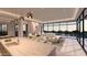 Bright living area featuring an expansive window with natural light, fireplace, and luxury seating at 7646 E Hidden Canyon St, Mesa, AZ 85207