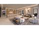 Open-concept living room showcasing a fireplace, modern furnishings, and seamless flow to the kitchen at 7646 E Hidden Canyon St, Mesa, AZ 85207