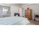 Bedroom featuring a bed, dresser, and sliding glass door to the exterior at 8140 N 107Th Ave # 120, Peoria, AZ 85345