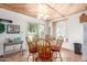 Charming dining area features tiled floors, a wood-paneled ceiling, and ample seating for six at 8140 N 107Th Ave # 120, Peoria, AZ 85345