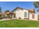 An inviting home shows off its manicured lawn, attractive landscape, and a cozy front porch at 8140 N 107Th Ave # 120, Peoria, AZ 85345