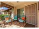 Welcoming front porch with decorative pillars and cozy seating; perfect spot to relax and enjoy the outdoors at 8140 N 107Th Ave # 120, Peoria, AZ 85345