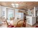 Cozy kitchen and breakfast nook with wood-paneled ceiling and arched window at 8140 N 107Th Ave # 120, Peoria, AZ 85345