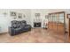 Inviting living room featuring beautiful tiled floors, a cozy fireplace, and stylish furnishings at 8140 N 107Th Ave # 120, Peoria, AZ 85345