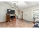 Sunny living room with tiled flooring, neutral walls, plenty of natural light, and a built-in display cabinet at 8140 N 107Th Ave # 120, Peoria, AZ 85345