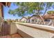 Private patio with tiled floor, stucco wall and views of the surrounding neighborhood at 8140 N 107Th Ave # 120, Peoria, AZ 85345