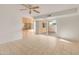 Living room featuring an open floor plan and sliding glass door to patio at 8317 E Orange Blossom Ln, Scottsdale, AZ 85250