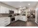 Modern kitchen featuring white cabinets, stainless steel appliances, subway tile backsplash, and sleek countertops at 8424 E San Bernardo Dr, Scottsdale, AZ 85258