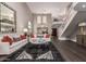 Bright and open living room with soaring ceilings, staircase, contemporary decor, and plenty of natural light at 8424 E San Bernardo Dr, Scottsdale, AZ 85258