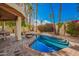 Sparkling backyard pool featuring mature palm trees, and steps leading into the water at 8424 E San Bernardo Dr, Scottsdale, AZ 85258