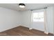 Bright bedroom with hardwood floors, a large window, and neutral paint, perfect for relaxation at 8621 E Vista Dr, Scottsdale, AZ 85250