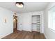 Cozy bedroom with hardwood floors, closet space, and natural light from the window, creating a peaceful atmosphere at 8621 E Vista Dr, Scottsdale, AZ 85250