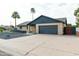 Charming single-story home with a two-car garage, brick accents and desert landscaping at 8621 E Vista Dr, Scottsdale, AZ 85250