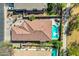 Stunning aerial view of a home with a refreshing pool, spa, and covered patio at 903 W Raven Dr, Chandler, AZ 85286