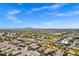 Vast aerial perspective showing the community, nearby mountains, and local retail centers at 903 W Raven Dr, Chandler, AZ 85286