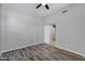 Neutral bedroom with ceiling fan, modern floors, and sliding door closet at 903 W Raven Dr, Chandler, AZ 85286