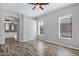 Spacious bedroom with multiple windows, ceiling fan, modern floors, and access to the ensuite bath at 903 W Raven Dr, Chandler, AZ 85286