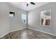 Neutral bedroom with multiple windows, ceiling fan and modern floors at 903 W Raven Dr, Chandler, AZ 85286