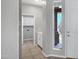 Bright entryway with tile flooring and white cabinetry with access to laundry area at 903 W Raven Dr, Chandler, AZ 85286