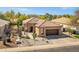 Attractive single-story home with a terracotta tile roof, desert landscaping, and a convenient attached garage at 903 W Raven Dr, Chandler, AZ 85286