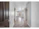 Bright and airy foyer with tile flooring and neutral walls leads into the home's open living spaces at 903 W Raven Dr, Chandler, AZ 85286