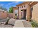 Charming front exterior with desert landscaping, a paved walkway, and a warm, inviting entrance at 903 W Raven Dr, Chandler, AZ 85286