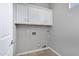 Laundry room features tile flooring, neutral colored walls and cabinets at 903 W Raven Dr, Chandler, AZ 85286