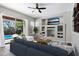 Open living area with tile flooring and a view of outdoor pool area through sliding glass doors at 903 W Raven Dr, Chandler, AZ 85286