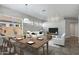 Open living area featuring dining set, tile flooring, and plenty of natural light at 903 W Raven Dr, Chandler, AZ 85286