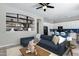 Open living area with tile flooring and a view of the kitchen with a breakfast bar at 903 W Raven Dr, Chandler, AZ 85286