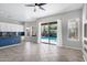 Open-concept living room offers direct access to a pool view through sliding glass doors at 903 W Raven Dr, Chandler, AZ 85286