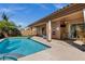 Backyard features a sparkling pool, spa, covered patio, and desert landscaping at 903 W Raven Dr, Chandler, AZ 85286