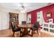 Dining room with hardwood floors, stylish furnishings, and ample natural light at 10425 W Desert Forest Cir, Sun City, AZ 85351