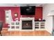 Close-up of the living room fireplace with built-in shelves and decorative mantel at 10425 W Desert Forest Cir, Sun City, AZ 85351