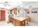 Bright kitchen with breakfast nook, stainless steel microwave and lots of cabinets at 10425 W Desert Forest Cir, Sun City, AZ 85351