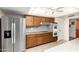 Spacious kitchen featuring stainless steel refrigerator and built in double oven at 10425 W Desert Forest Cir, Sun City, AZ 85351