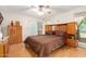 Bedroom features a ceiling fan, window and a large closet, providing plenty of storage space at 10425 W Desert Forest Cir, Sun City, AZ 85351