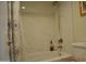 Clean bathroom featuring a tile-surround bathtub and a brushed nickel shower head at 10444 N 69Th St # 128, Paradise Valley, AZ 85253