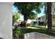 Beautiful courtyard view with lush green grass and mature trees with well-maintained landscaping at 10444 N 69Th St # 128, Paradise Valley, AZ 85253