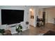 A view of the living room and bathroom featuring warm natural light and comfortable seating at 10444 N 69Th St # 128, Paradise Valley, AZ 85253